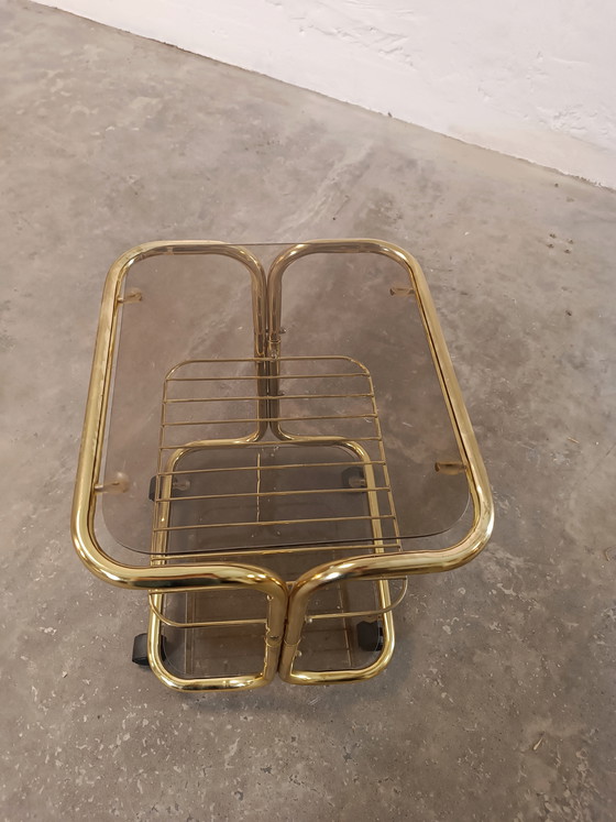 Image 1 of Vintage gold coloured and glass trolley side table 