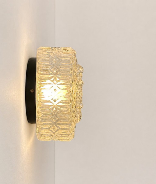 Pair of vintage wall sconces, metal and pressed molded glass, France, 1970