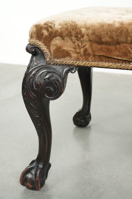Image 1 of Antiek Hollands zitje/ hocker uit de 18e eeuw met velours stof, mooi houtsnijwerk en klauwpoten