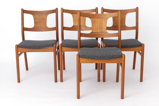Four wooden dining chairs with grey upholstery