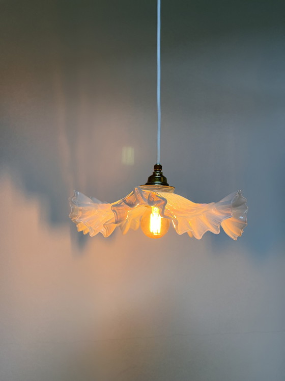 Image 1 of Atmospheric vintage pendant light featuring a distinctive glass shade, likely of French origin