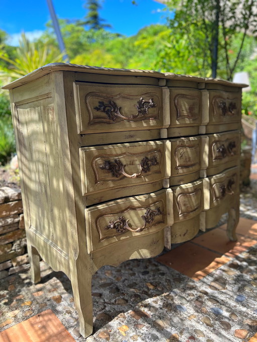 Antique curved chest of drawers with a pistachio green patina