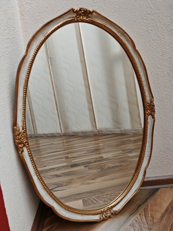 Image 1 of Oval mirror with wooden frame, white, gold from an estate