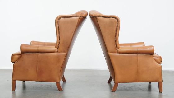 Image 1 of 2x Rundleren oorfauteuil afgewerkt met siernagels