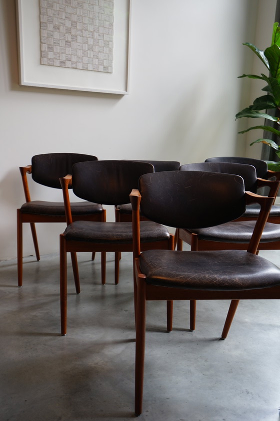 Image 1 of 6 Kai Kristiansen stoelen | Model 42 | Teak Leder patina