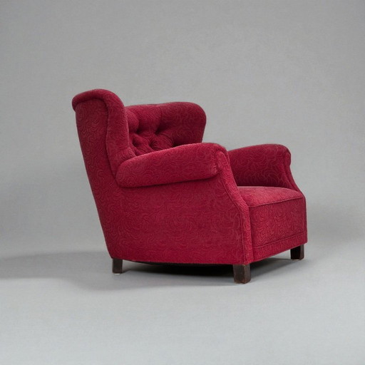 Fauteuil relax danois des années 1950, tissu d'ameublement rouge, pieds en bois de frêne.