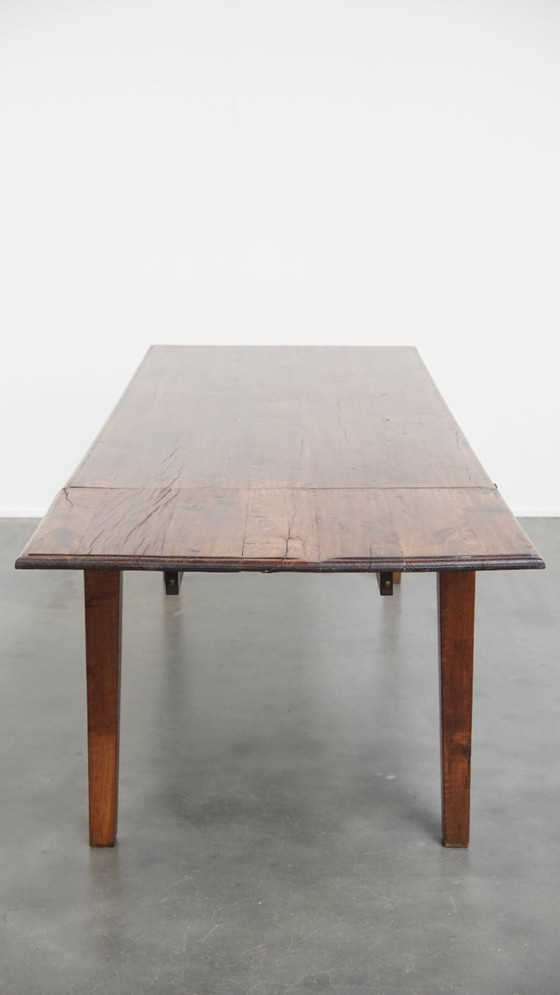 Image 1 of Table de salle à manger ancienne en chêne du début des années 1900 avec plateau rabattable d'un côté