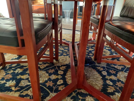 Image 1 of Rectangular long dining table with four luxurious leather-upholstered chairs by Schuitema Stadskanaal. In very good condition.