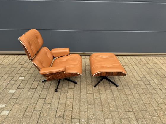 Image 1 of Poltrona lounge Vitra Eames XL + poggiapiedi, in pregiata pelle nera e palissandro Santos. NUOVA!!