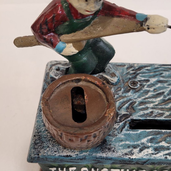 Image 1 of "Fisherman" piggy bank with fishing mechanism, cast iron, 1950s - USA.