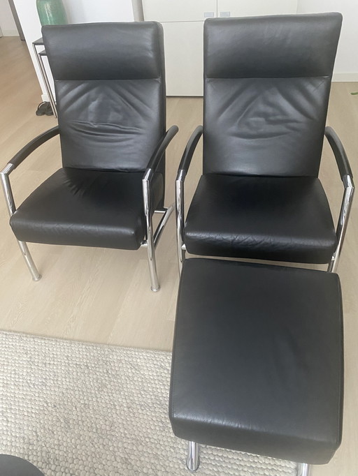 2 poltrone Leolux e un pouf