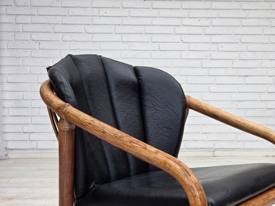 Image 1 of 1970s, Danish armchair, rattan, black artificial leather.