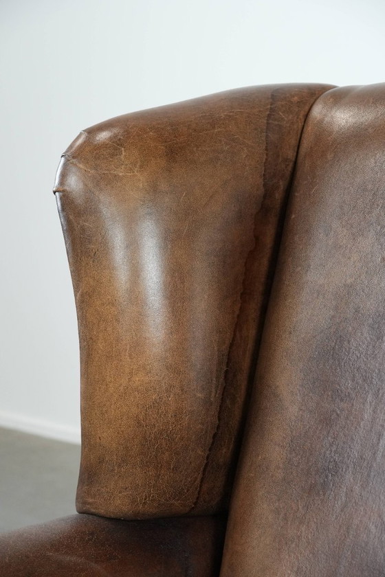 Image 1 of Comfortable vintage sheepskin wing chair with character