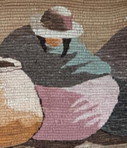 Hand-woven wall hanging in earth tones