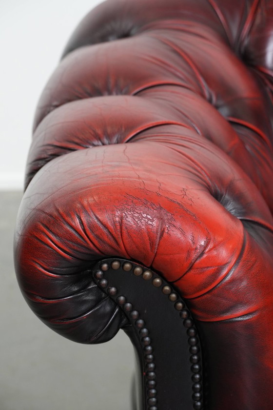 Image 1 of Rode rundleren chesterfield buttonseat fauteuil