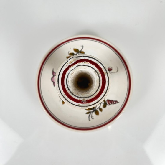 Image 1 of Handbeschilderde keramische kaarsenhouder met bloemenmotief.