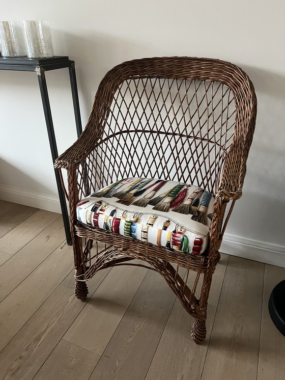 Image 1 of Pierre Frey geflochtener Sessel mit Kissen