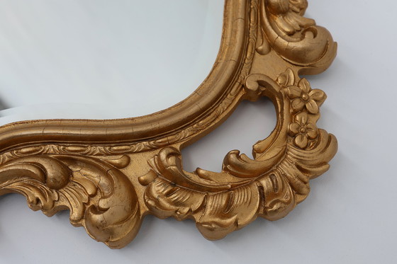 Image 1 of French Rococo or Baroque style facet-cut crest mirror in gilded carved wood