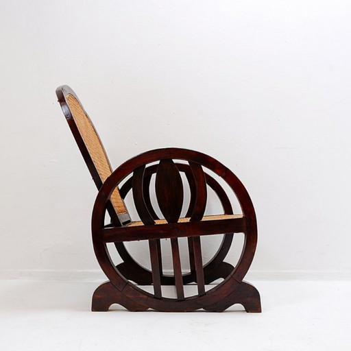 Art Deco armchairs in wood, with caned seat and back, circa 1930