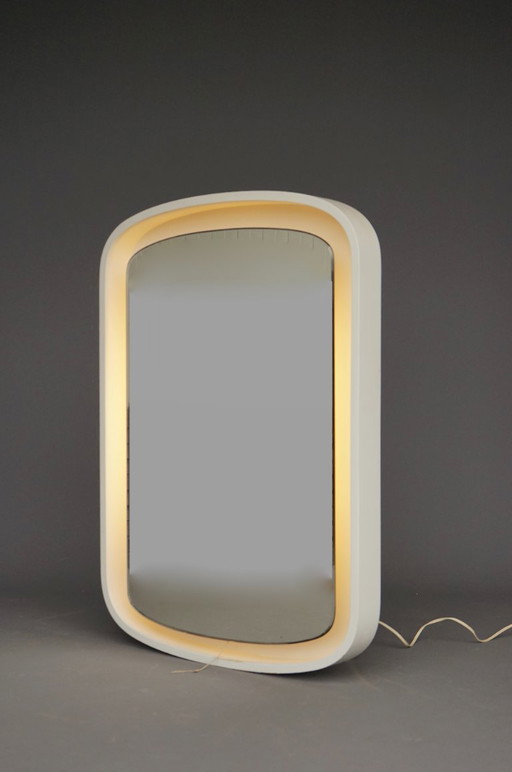 A large 1970s vintage backlit mirror in white plywood frame
