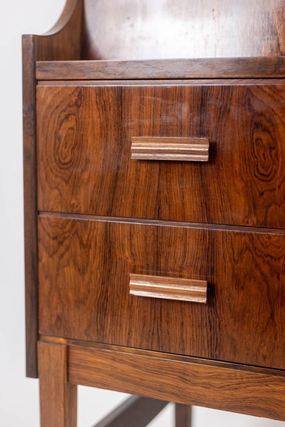 Image 1 of Commode van palissanderhout met 2 laden, die tevens als secretair dient. Jaren 70.
