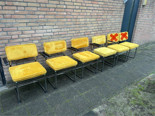 4 sedie in tessuto a coste gialle con struttura tubolare cromata