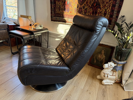 Image 1 of Dark brown vintage leather lounge armchair – timeless luxury and character
