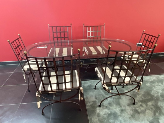 Image 1 of Wrought iron dining room table with 6 chairs made in Provence by local art smith (2005).
