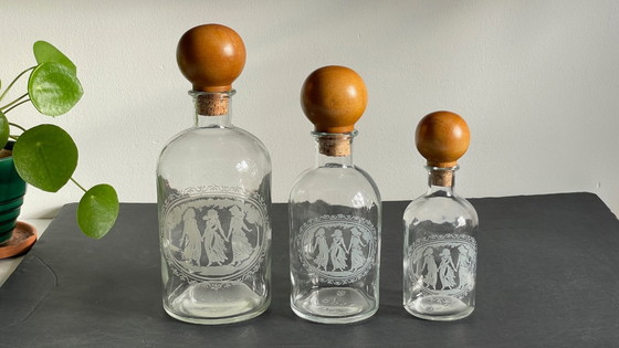 Image 1 of Vintage Engraved Glass and Wood Bottles