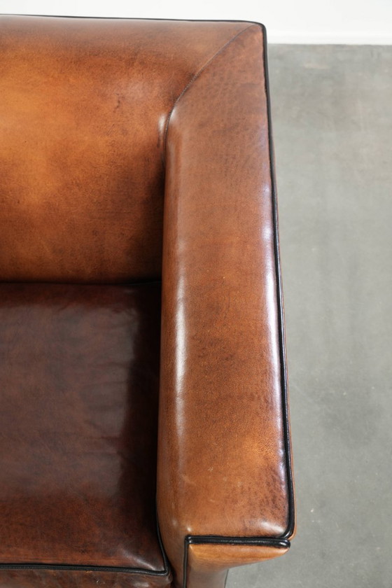 Image 1 of Sheepskin Art Deco design armchair with black piping
