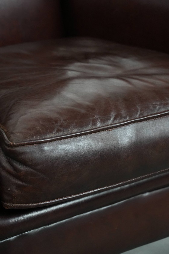 Image 1 of Donkere luxe schapenleren fauteuil/ armchair met een tijdloze uitstraling