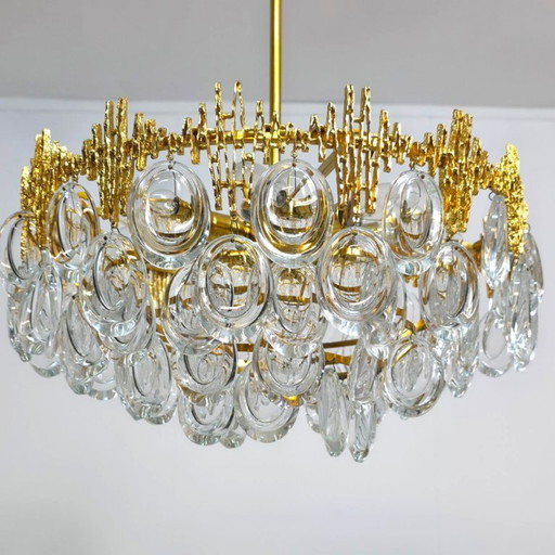 Palwa chandelier in a 1960s Brutalist style with a warm touch. Brass with crystal glass.