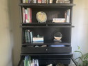 Black bookcase with glass doors and drawers