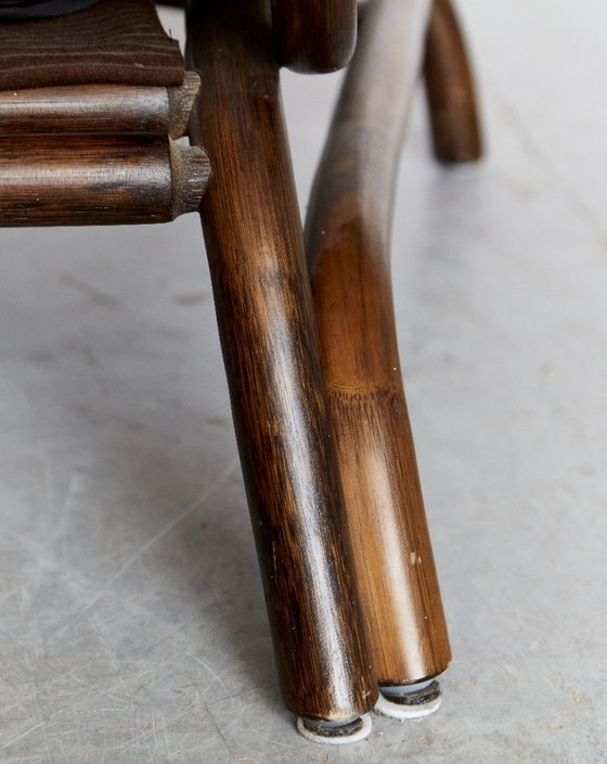 Image 1 of Fauteuil en voetenbank van bamboe en leer