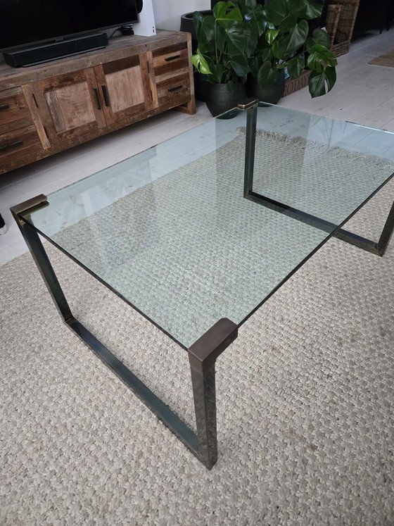 Image 1 of Coffee table made of sturdy glass and a designer metal frame