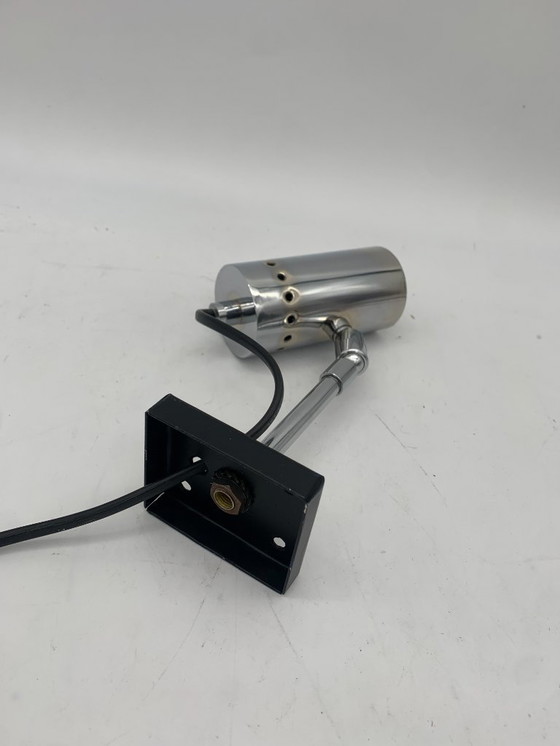 Image 1 of Een paar chromen wandlampen en spotjes, toegeschreven aan Stilnovo.