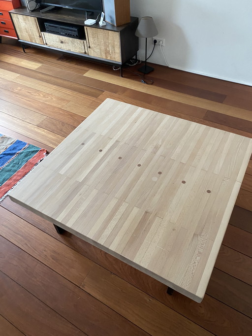 Coffee table with a historic charm. Old bowling lane wood top. Stylish chassis of powder coated black metal
