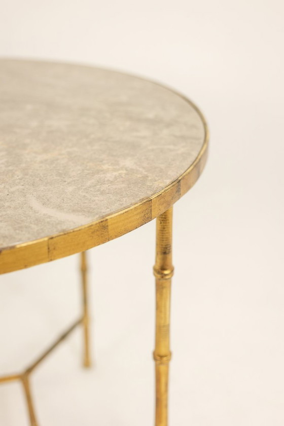 Image 1 of Pedestal table. Gilt metal base and grey marble top. 20th century.