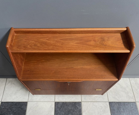 Image 1 of Teak tall sideboard on lucite legs 1960s