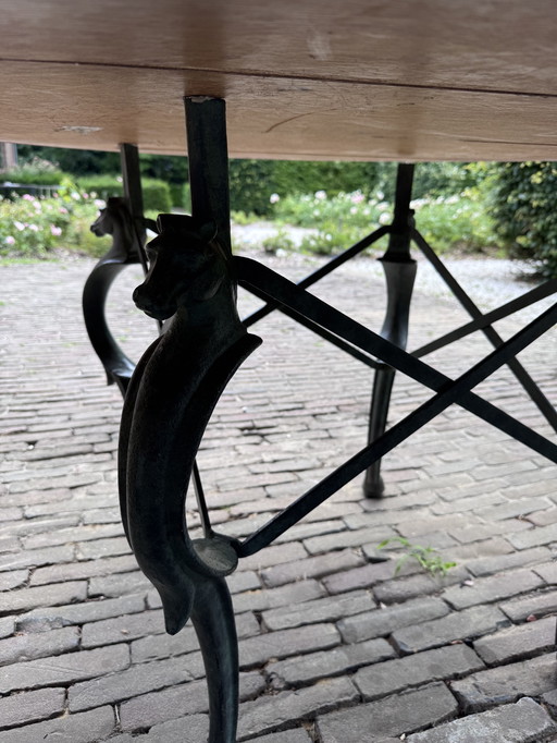 For sale antique table with cast iron decorative base
