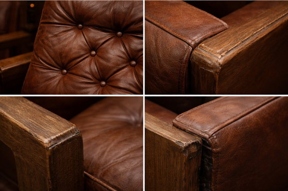 Image 1 of A vintage brown three-piece sofa set in leather with wooden armrests and turned legs, comprising a 1-seater, 2-seater and 3-seat