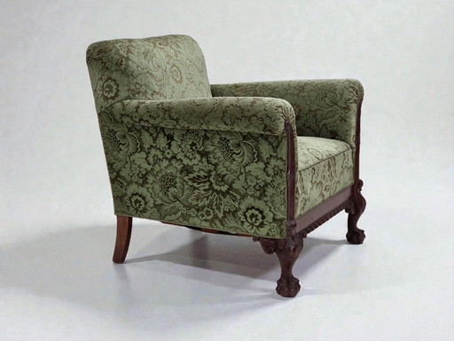 Dänischer Sessel aus den 1950er Jahren, grüner Möbelveloursbezug, geschnitztes Eichenholz.