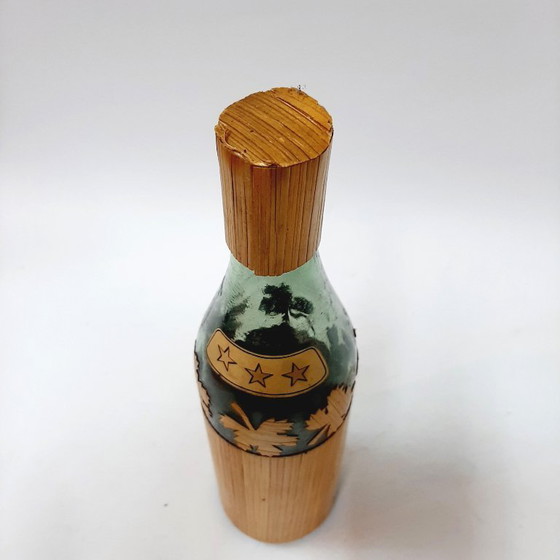 Image 1 of Vintage glazen fles omwikkeld met riet