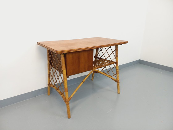 Image 1 of Vintage Louis Sognot bureau in rotan en hout uit de jaren 60