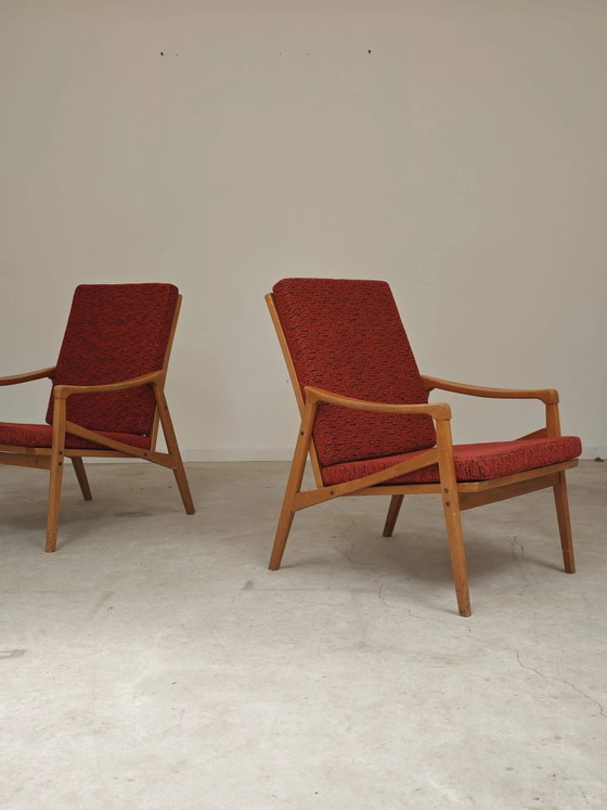Pair of Jiri Jiroutek red armchairs by Intérier Praha – Wood, Mid Century Modern (photo 2 of 13)