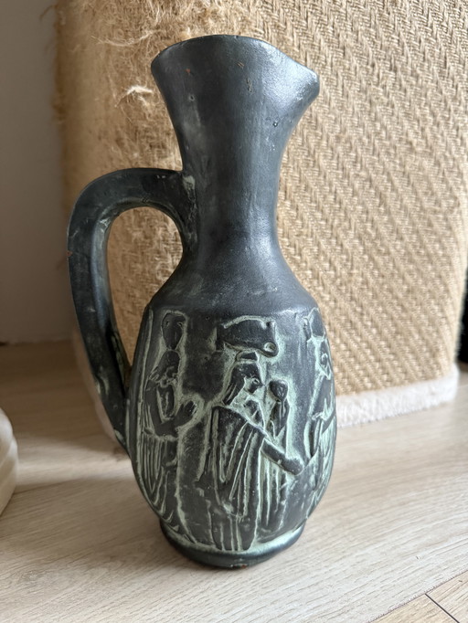 Vintage Greco-Roman style jug featuring relief figures