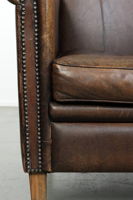 Image 1 of 2 fauteuils design en peau de mouton avec une belle patine