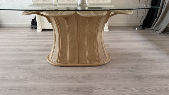 Image 1 of Beautiful glass dining table with a unique rattan base
