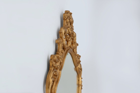 Image 1 of French Rococo or Baroque style facet-cut crest mirror in gilded carved wood