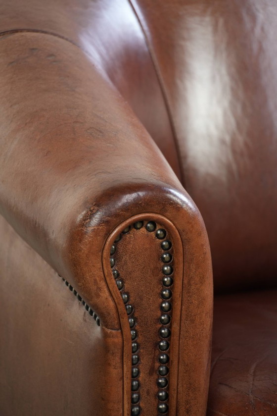 Image 1 of Mooie vintage schapenleren clubfauteuil in Engelse stijl met prachtige diepe kleuren